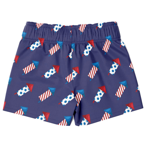 Navy blue boys firework rocket quick drying swim trunks with red white and blue fireworks pattern