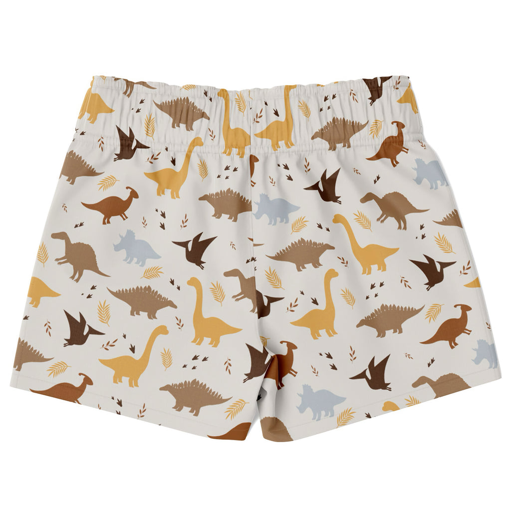 Boys white quick drying swim trunks with playful brown yellow and gray dinosaur pattern and leaf accents