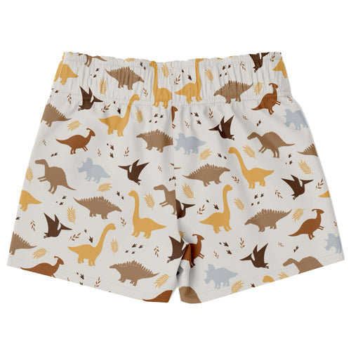 Boys white quick drying swim trunks with playful brown yellow and gray dinosaur pattern and leaf accents