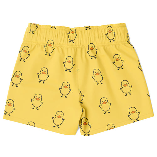 Yellow boys quick drying swim trunks with black outlined cartoon ducks and orange beaks and feet pattern