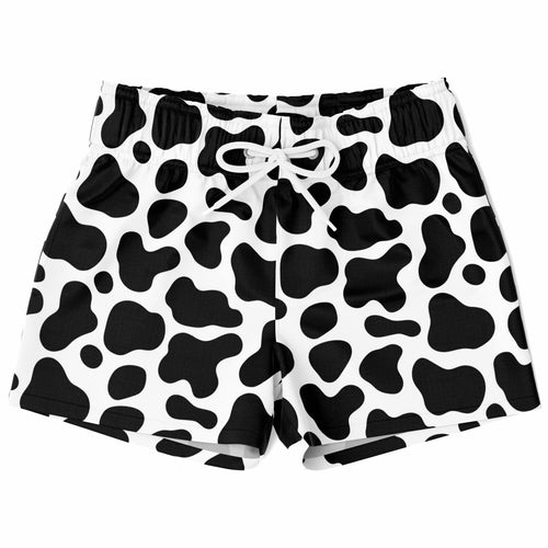 Boys cow print quick drying swim trunks in black and white with a drawstring waistband for comfortable fit
