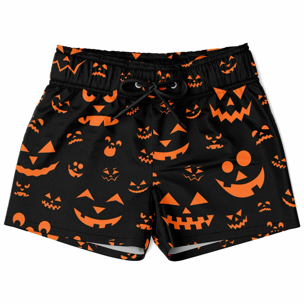 Boys orange jack-o-lantern faces halloween quick drying swim trunks in black with vibrant pumpkin face pattern