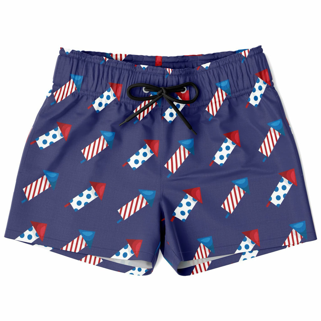 Navy blue boys firework rocket quick drying swim trunks with red white and blue fireworks pattern