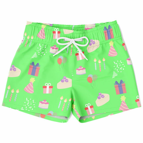 Green swim shorts with birthday cake and gift pattern on a white background