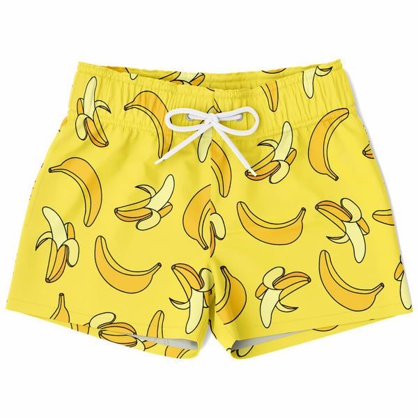 Boys bright yellow quick drying swim trunks with a playful cartoon banana pattern for beach and pool use