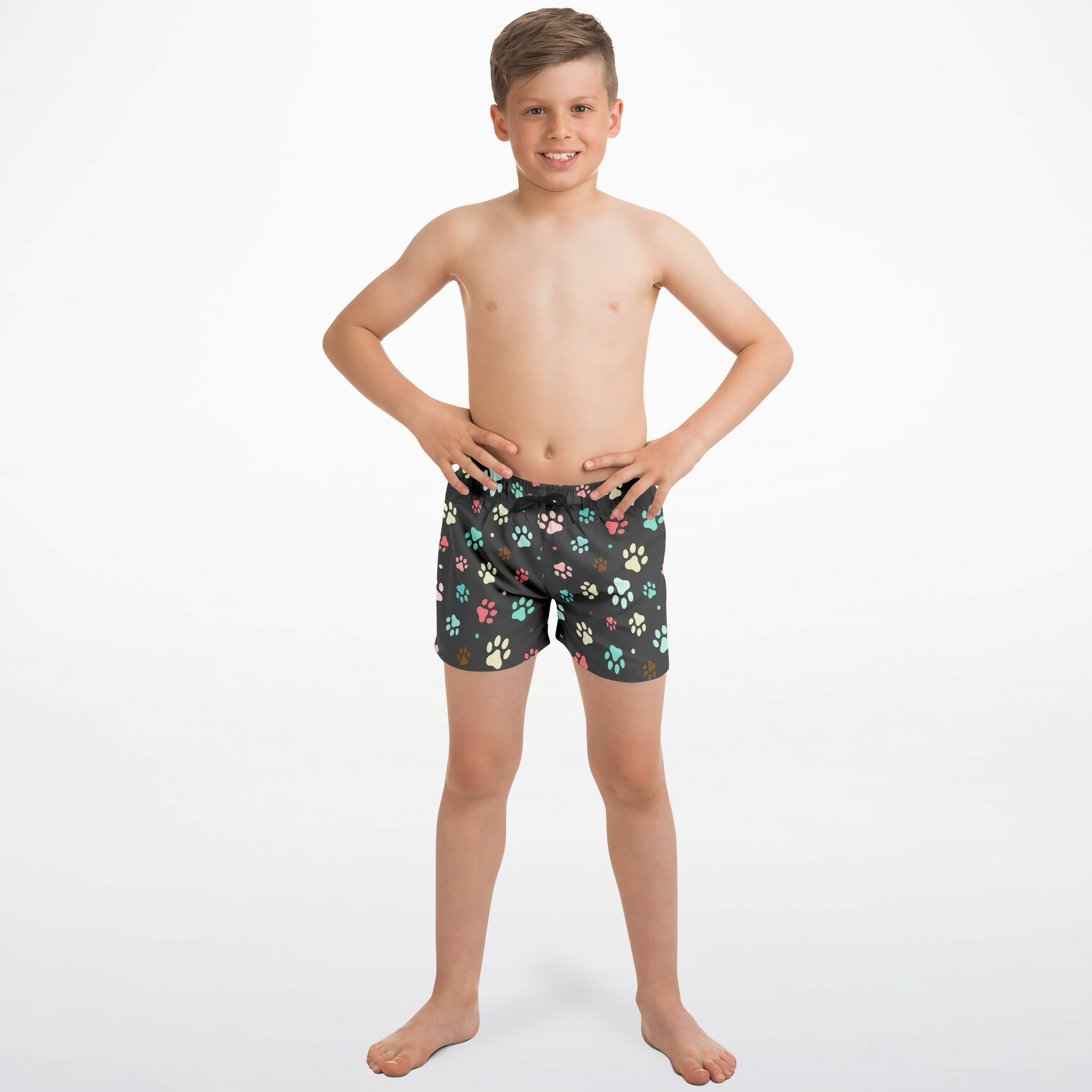 Boys colorful paw print quick drying swim trunks in dark green with multicolored paw prints in pink teal and beige