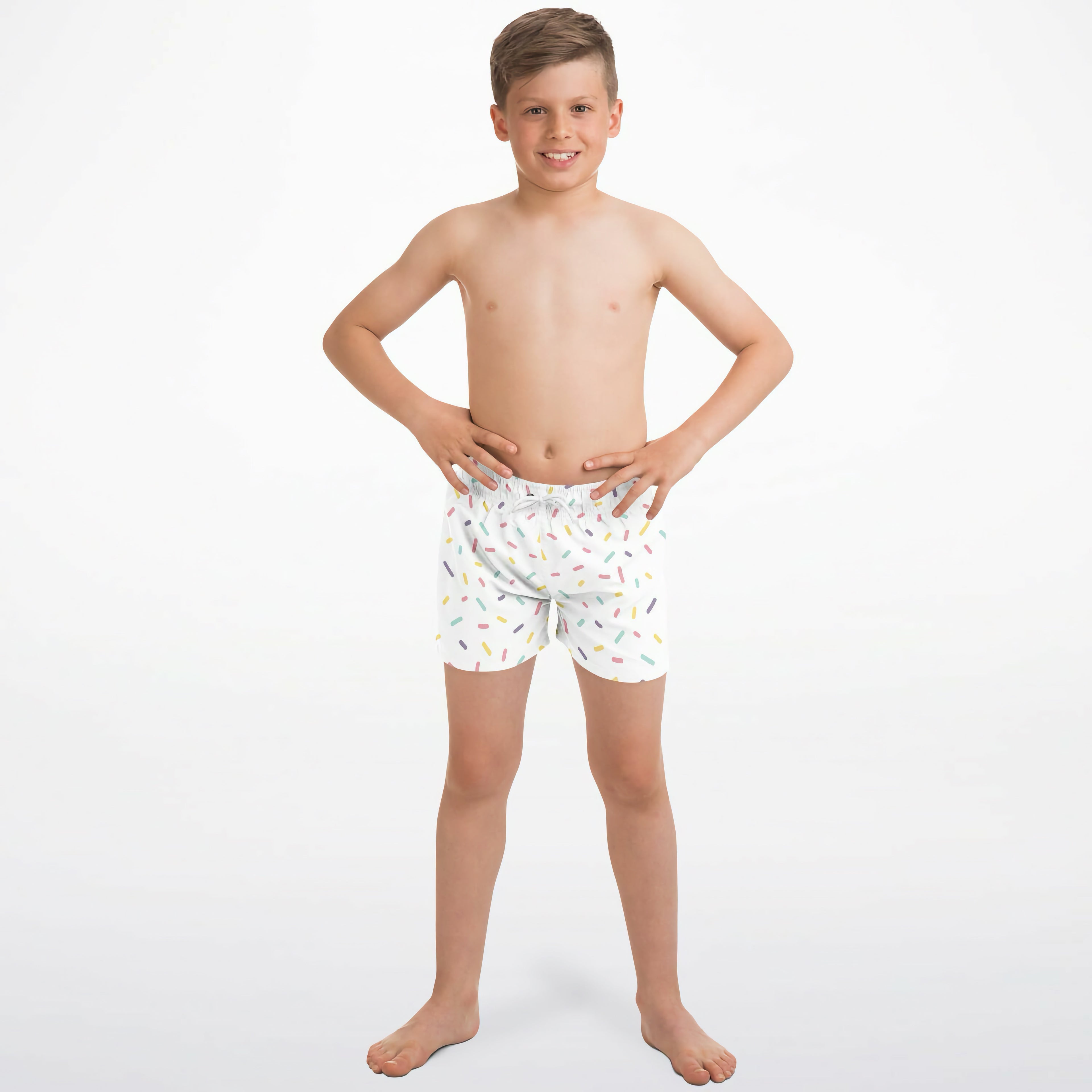 White boys quick drying swim trunks with colorful sprinkle pattern and playful design for summer fun