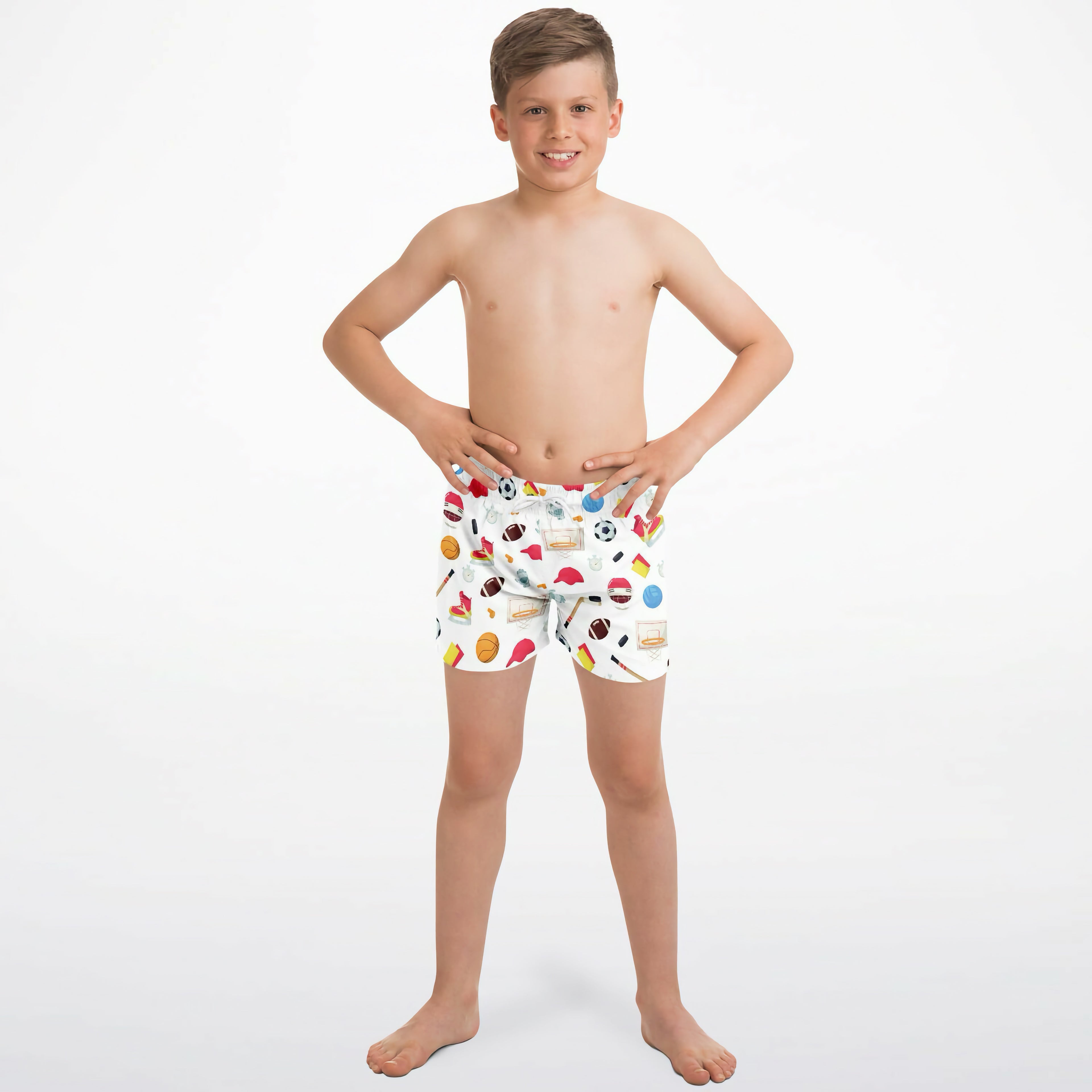 White boys sports-themed quick drying swim trunks with colorful soccer balls basketballs and flags pattern