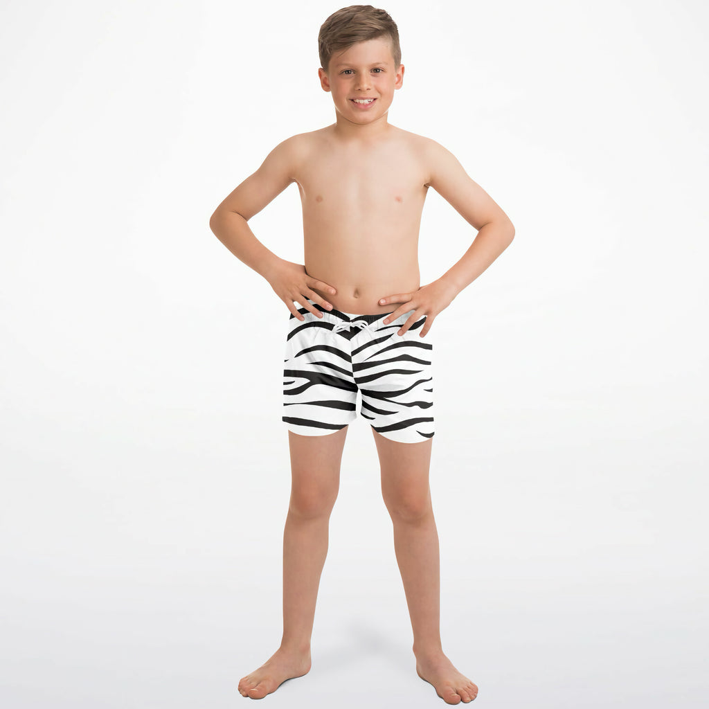 Boys zebra print quick drying swim trunks featuring black and white stripes for comfortable water activities