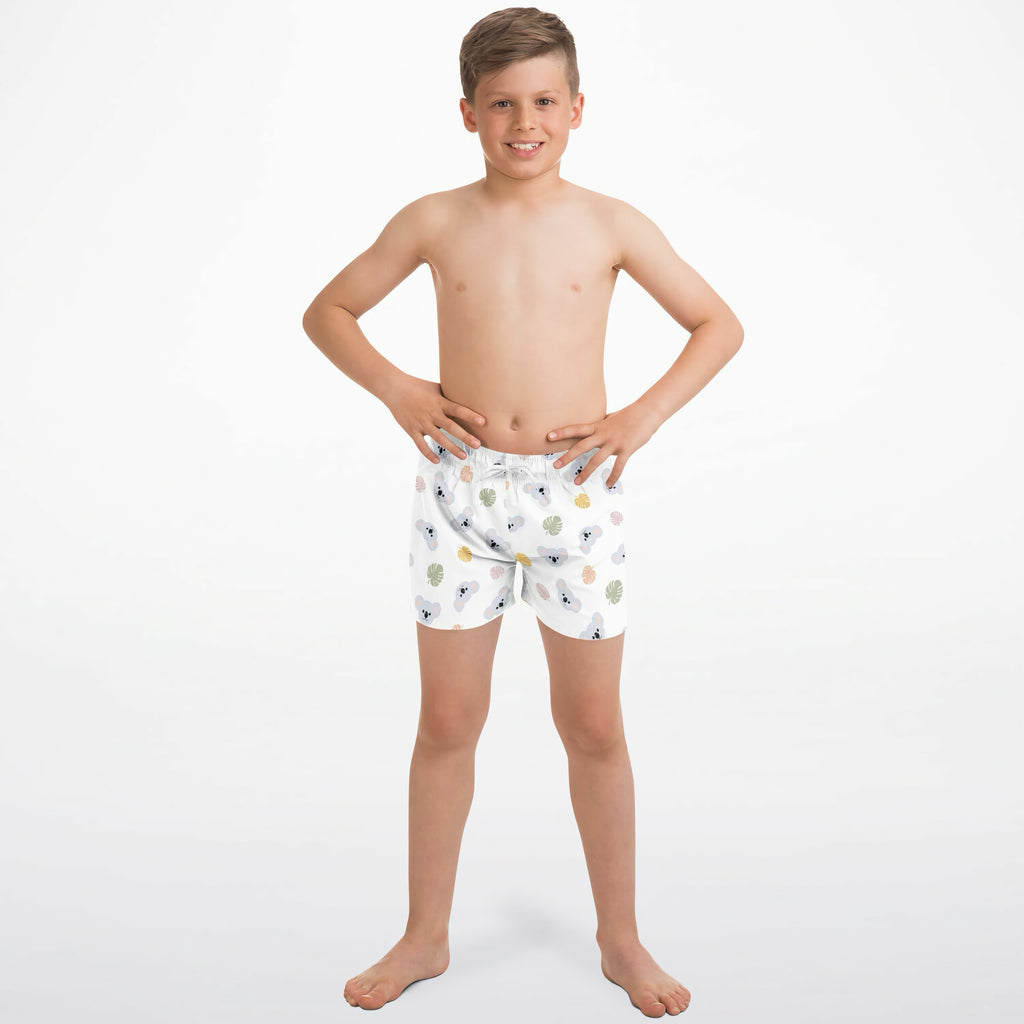 White boys koala bear quick drying swim trunks with playful gray and yellow seashell fish and coral pattern