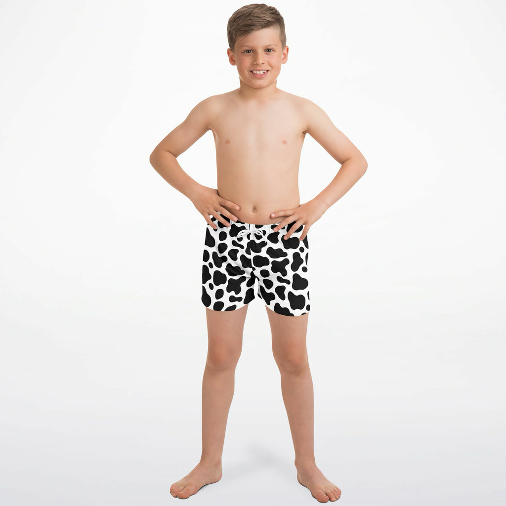 Boys cow print quick drying swim trunks in black and white with a quick dry fabric for swimming and beach use