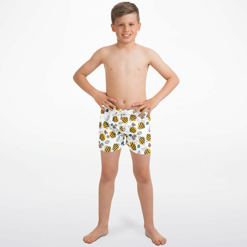 Boys bumblebee quick drying swim trunks in white with playful yellow and black cartoon bee pattern for swimming