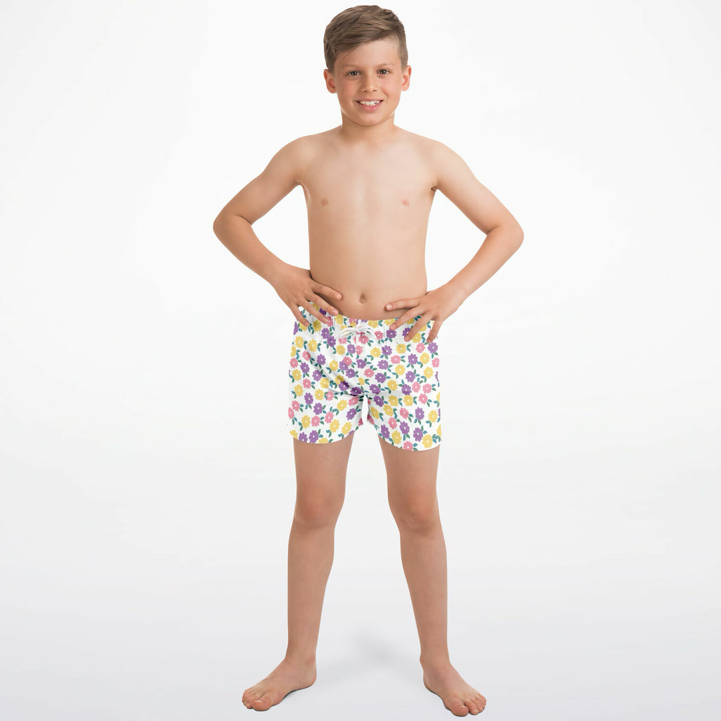 Boys colorful flower print quick drying swim trunks in white with purple pink and yellow floral pattern