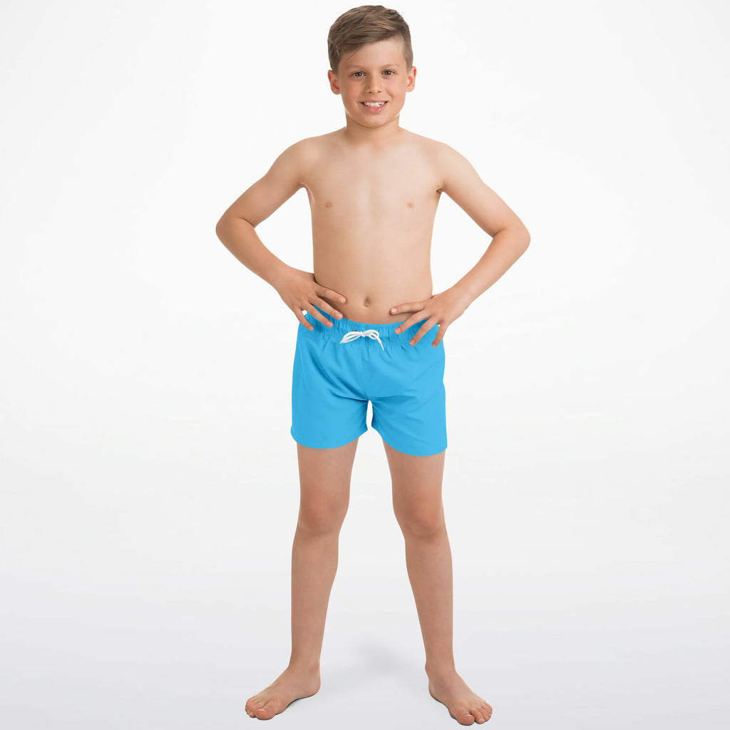 Boys sky blue quick drying swim trunks with bright blue fabric and white drawstring waistband for swimming