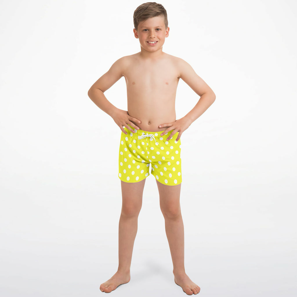 Boys yellow polka dots quick drying swim trunks in bright lime green with white polka dots and matching drawstring waistband