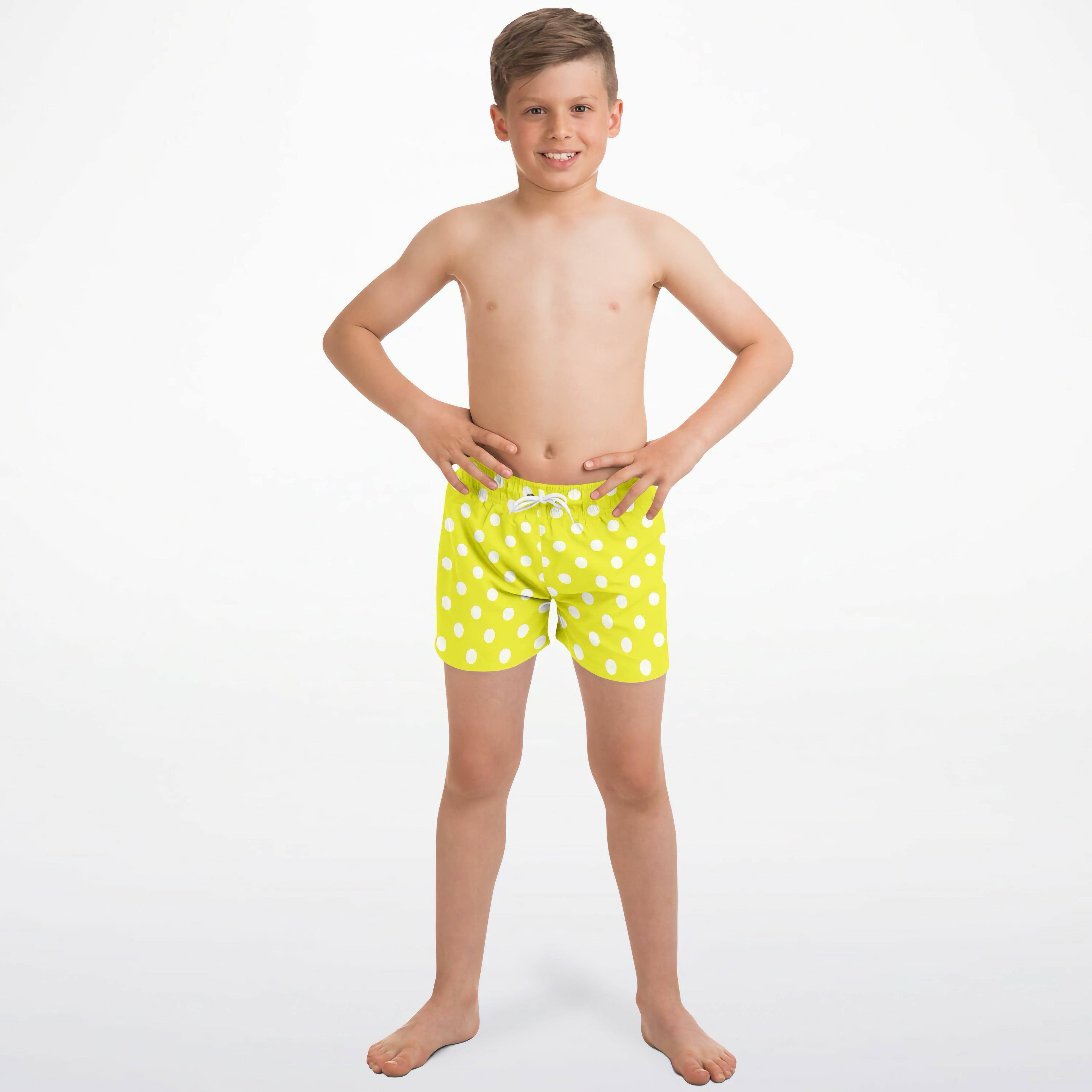 Boys yellow polka dots quick drying swim trunks in bright lime green with white polka dots and matching drawstring waistband