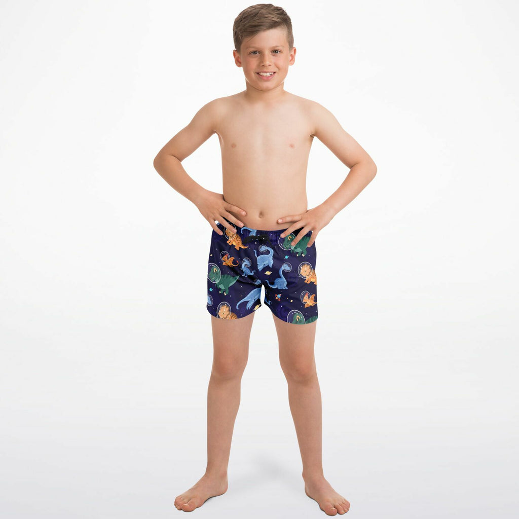 Navy blue boys space dinosaur quick drying swim trunks with vibrant orange green and light blue playful pattern