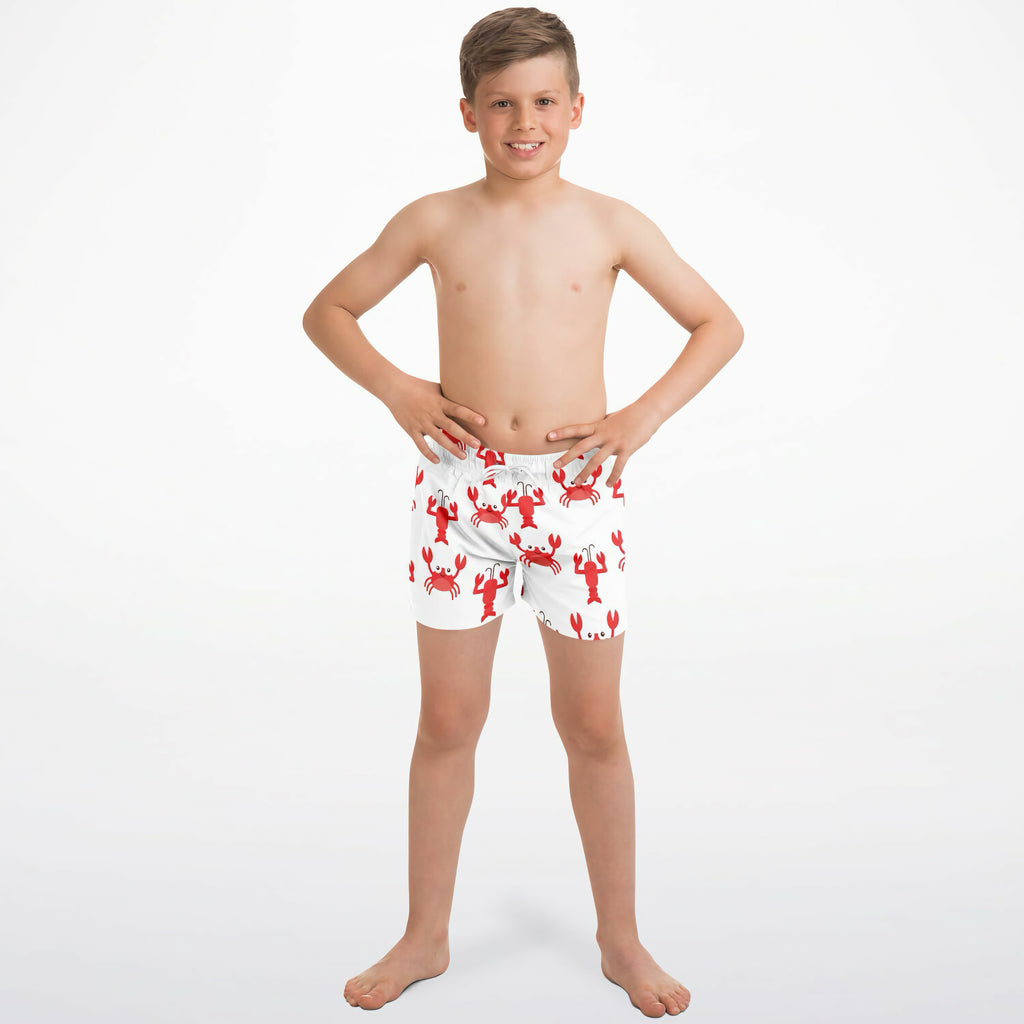 White quick drying boys swim trunks with red lobster and crab pattern for beach and pool use