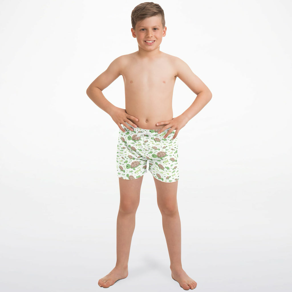 White boys sea turtles quick drying swim trunks with a playful green and brown turtle pattern