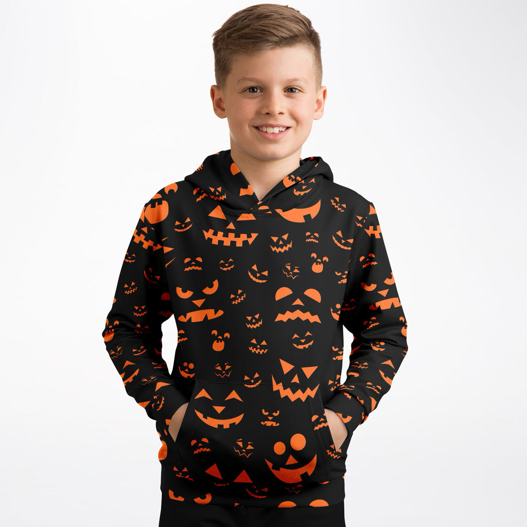 Kids orange jack-o-lantern halloween hoodie in black with orange pumpkin prints made of cozy cotton fleece