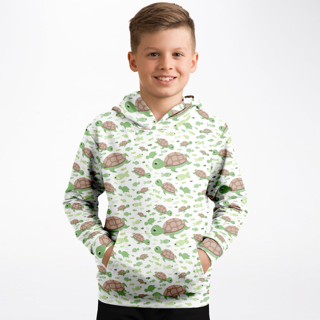 Kids white hoodie with playful green and brown cartoon sea turtles print made of cozy cotton fleece or lightweight sports fabric