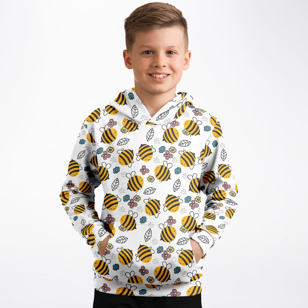 Kids yellow bee hoodie in white cotton fleece with playful yellow and black bees green leaves and pastel flowers pattern