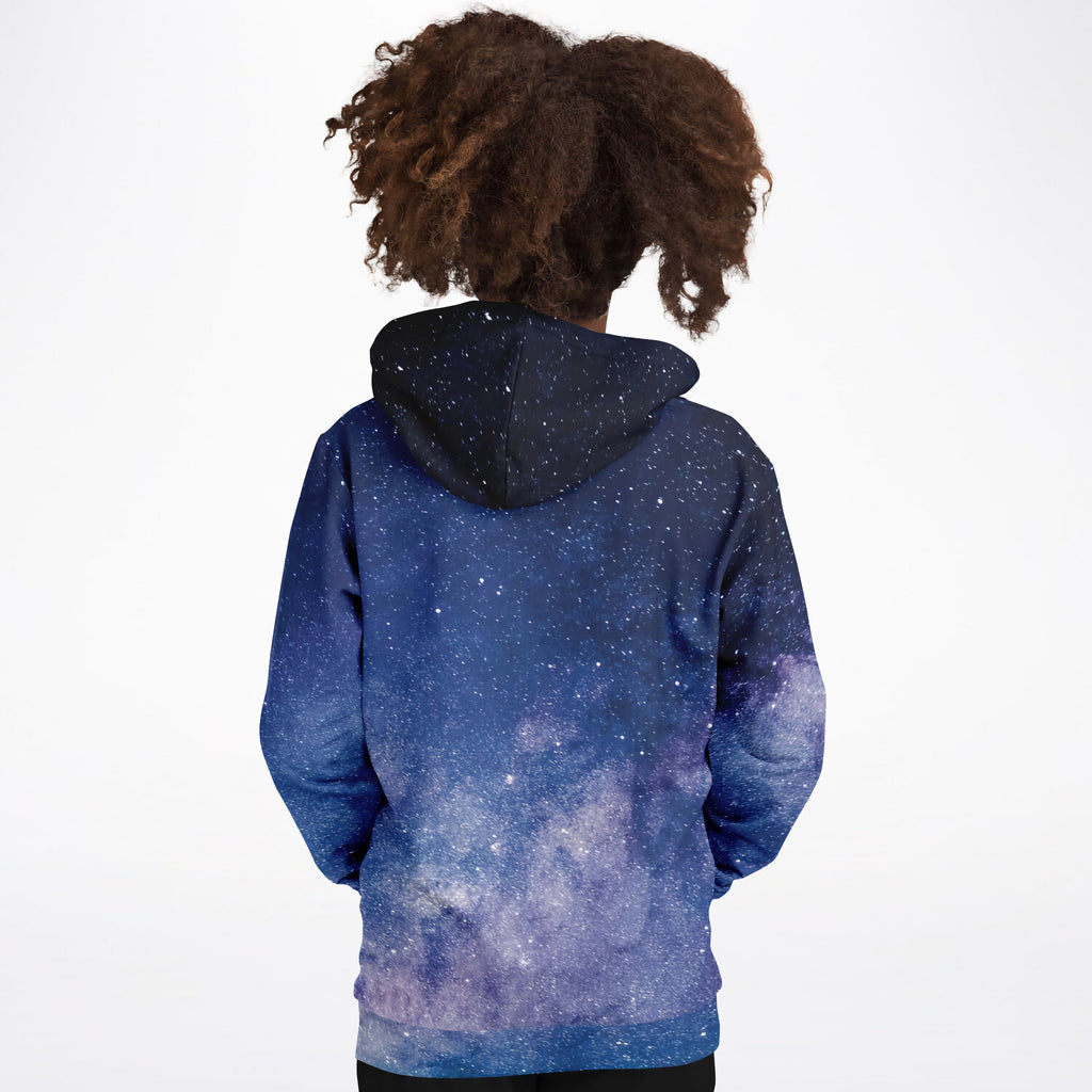 A child wearing a navy blue and purple kids realistic galaxy hoodie with white stars made of cozy cotton fleece
