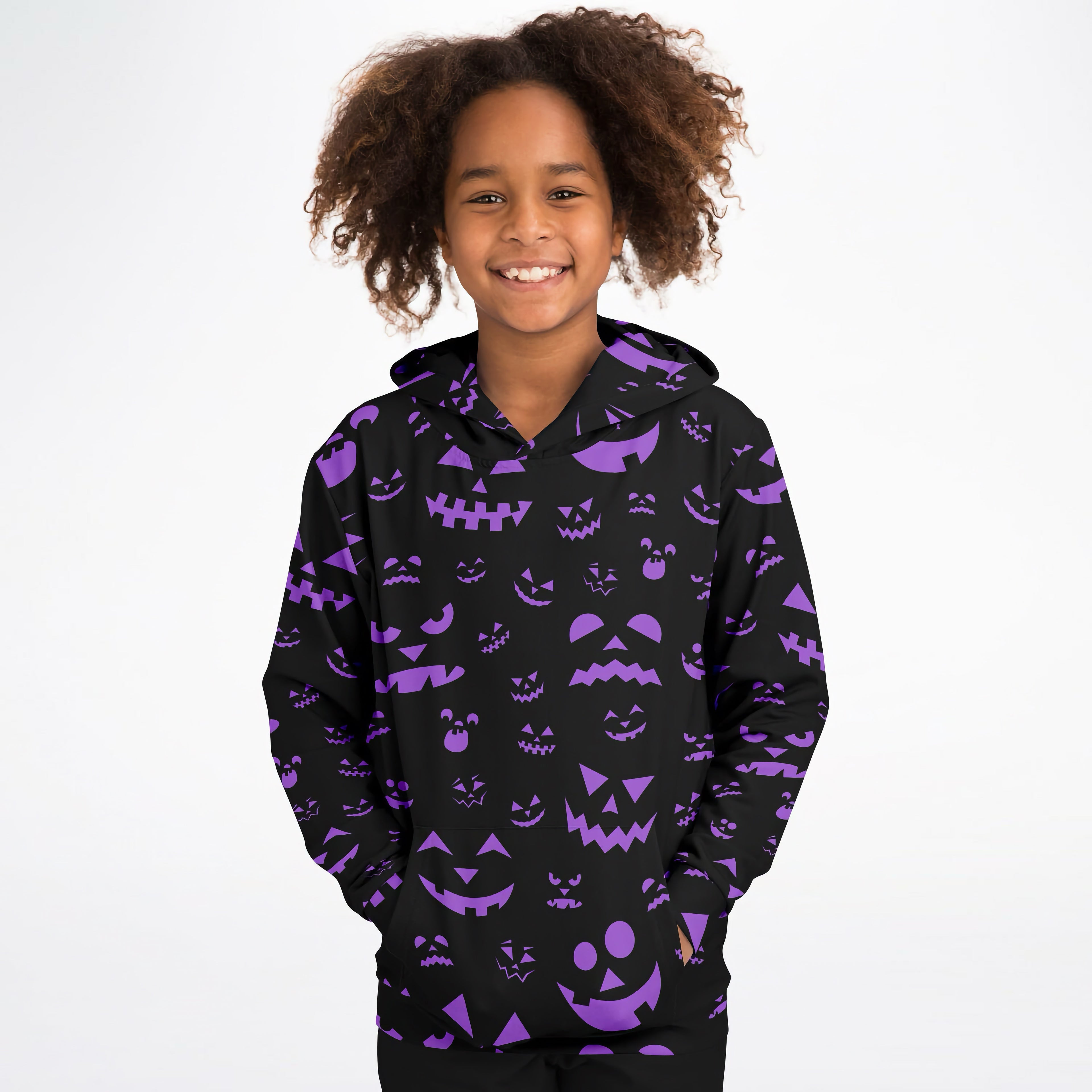 Black kids hoodie with purple jack-o-lantern faces all over made of cozy cotton fleece for halloween wear