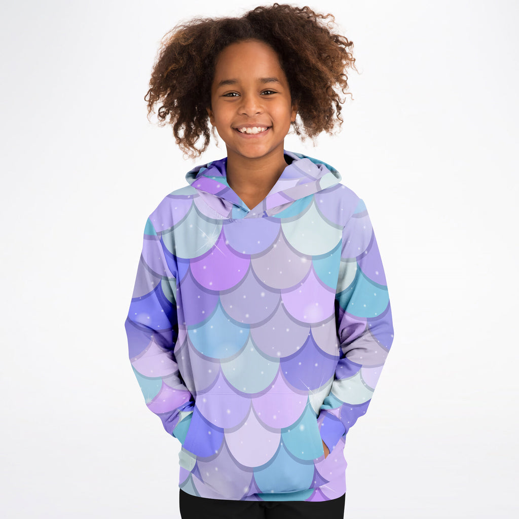 A child wearing a girls purple mermaid hoodie with glittery dots made of cozy cotton fleece or lightweight fabric