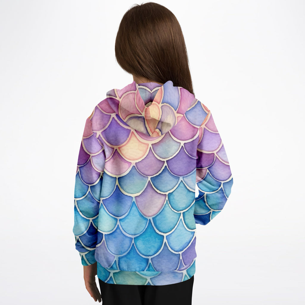 A child wearing a girls watercolor mermaid hoodie with vibrant purple pink and blue scales in cozy cotton fleece