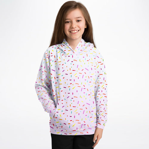 A white girls hoodie with a playful multicolored sprinkles pattern made of cozy cotton fleece or lightweight sports fabric