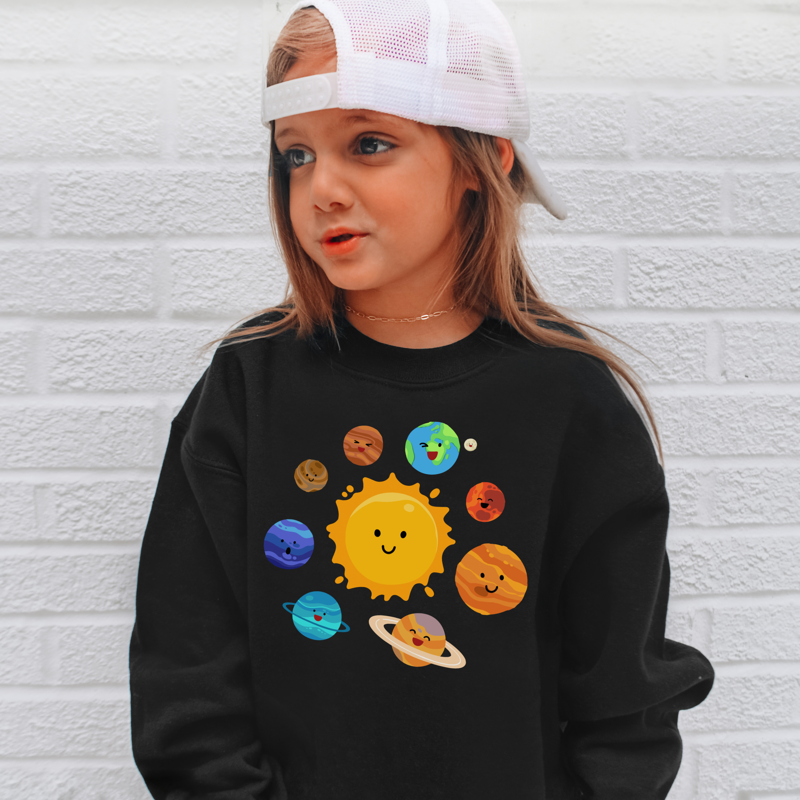 Black long-sleeved sweatshirt with colorful cartoon solar system design featuring smiling planets and sun for kids