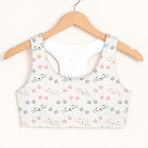 White girls cat paw print sports bra with playful pink and gray cat faces and quick drying double layered comfort