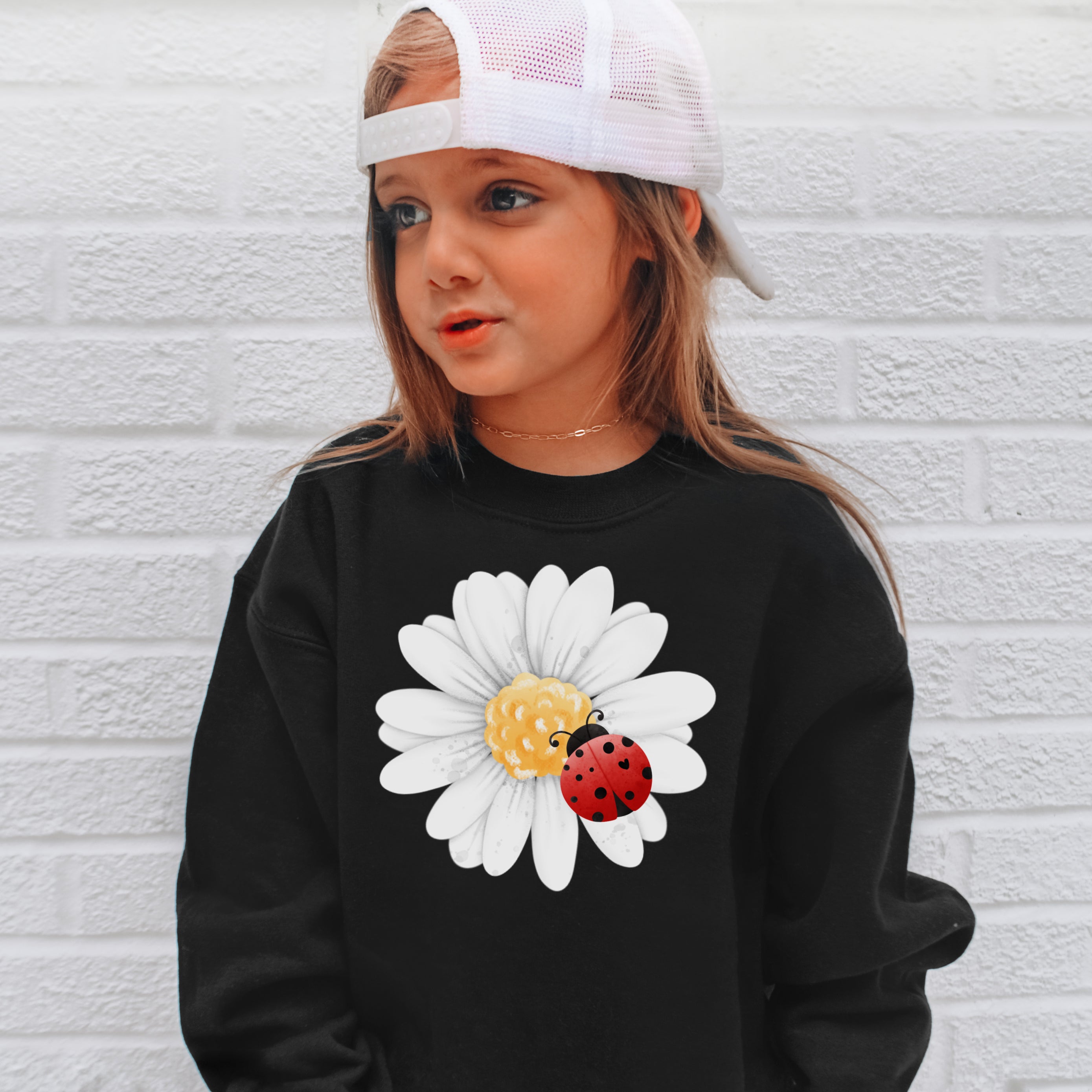 Black kids sweatshirt with white daisy and red ladybug design on front cute flower and insect pullover