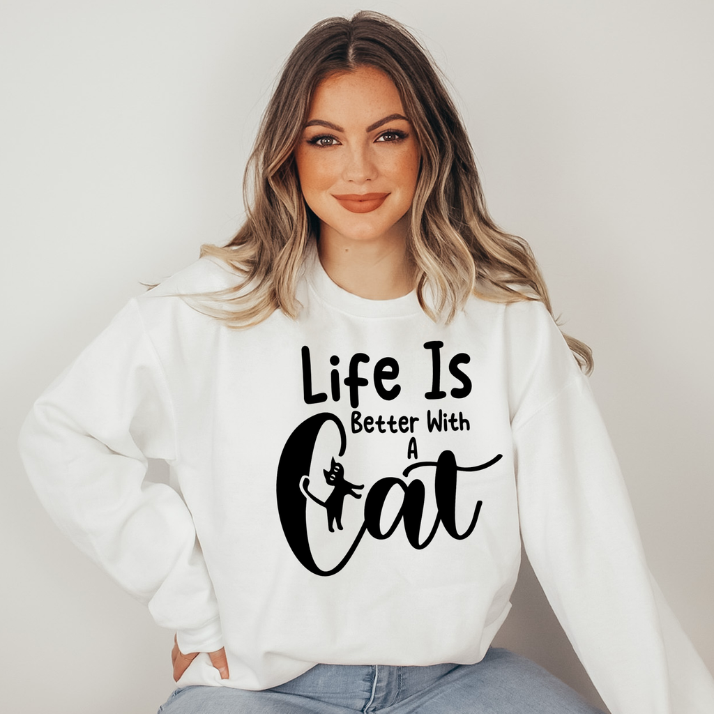 Woman wearing a white sweatshirt with 'Life Is Better With A Cat' text.