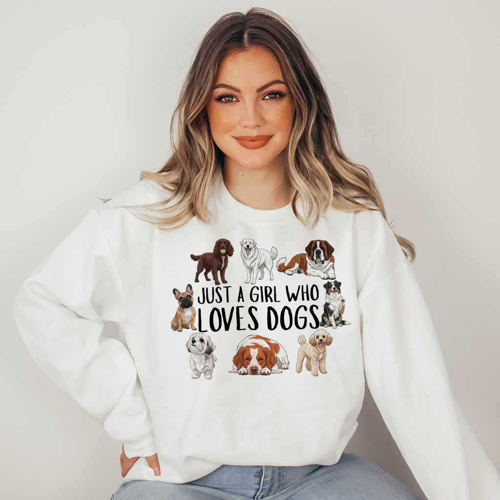 Woman wearing a white sweatshirt with dog illustrations and text on a plain background
