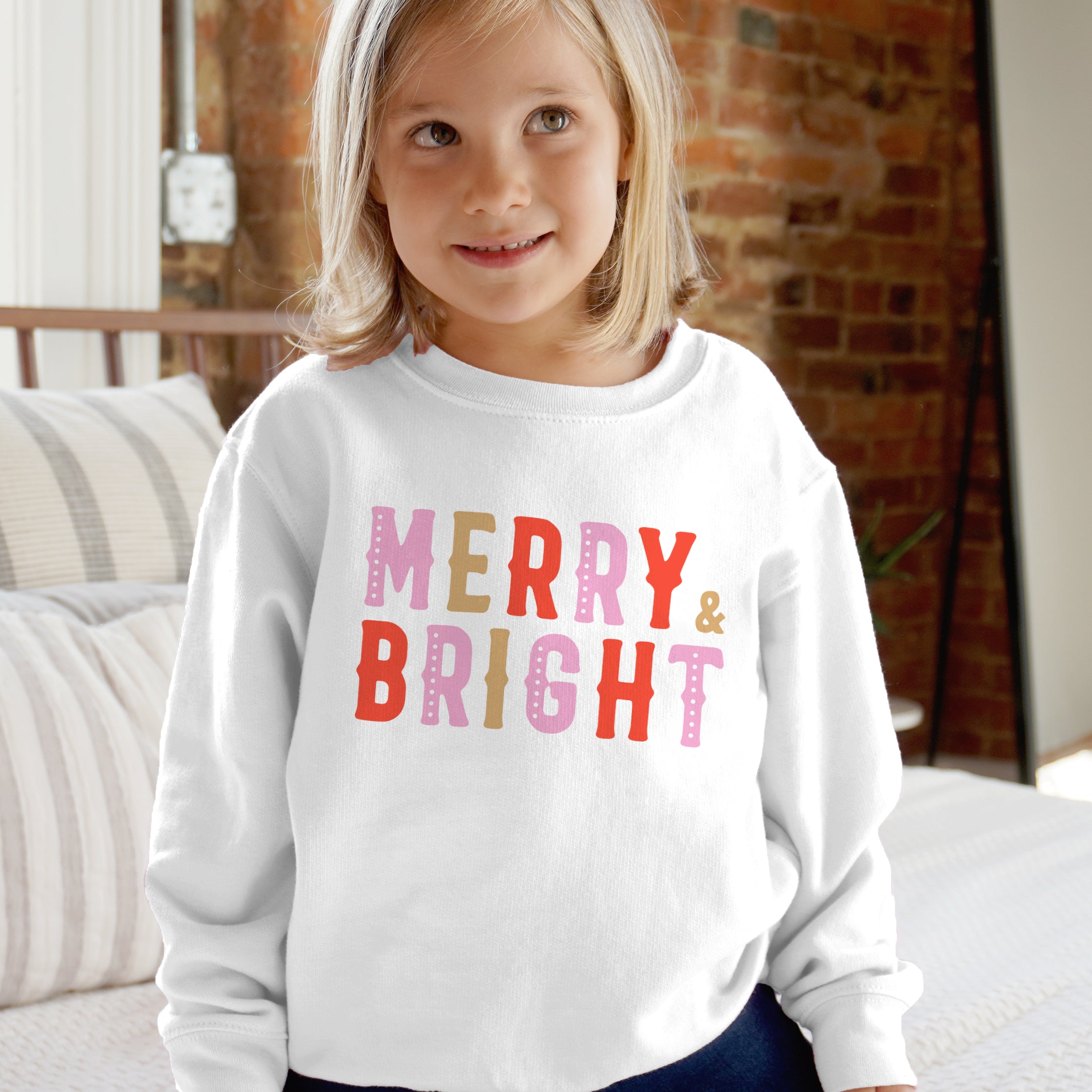 White long-sleeved kids sweatshirt with merry and bright colorful polka-dotted letters for holiday wear
