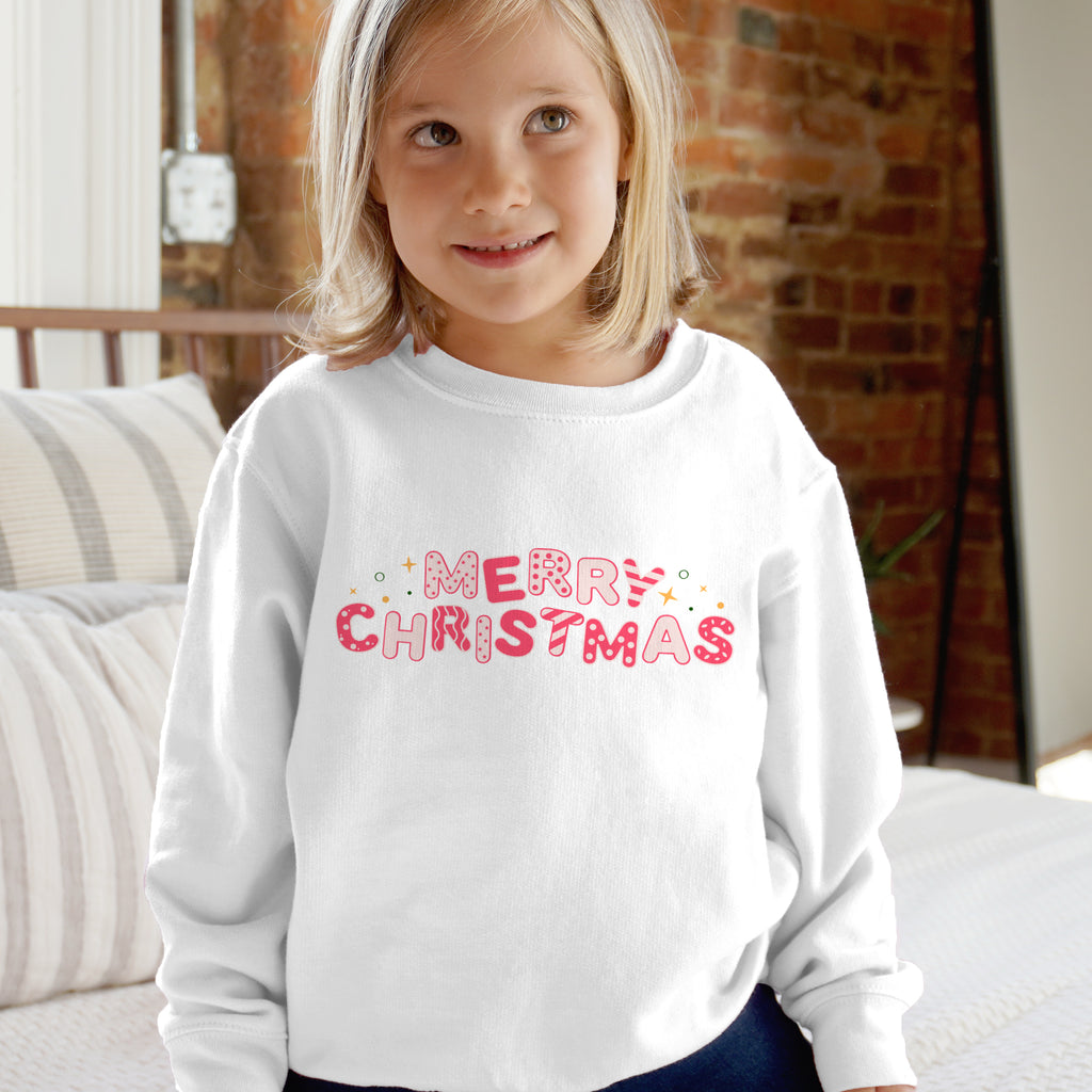White kids long-sleeved sweatshirt with merry christmas in pink and decorative dots and stars for holiday wear