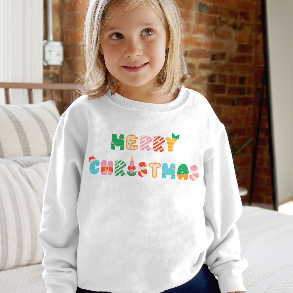 White long-sleeved kids sweatshirt with colorful merry christmas lettering perfect for holiday wear