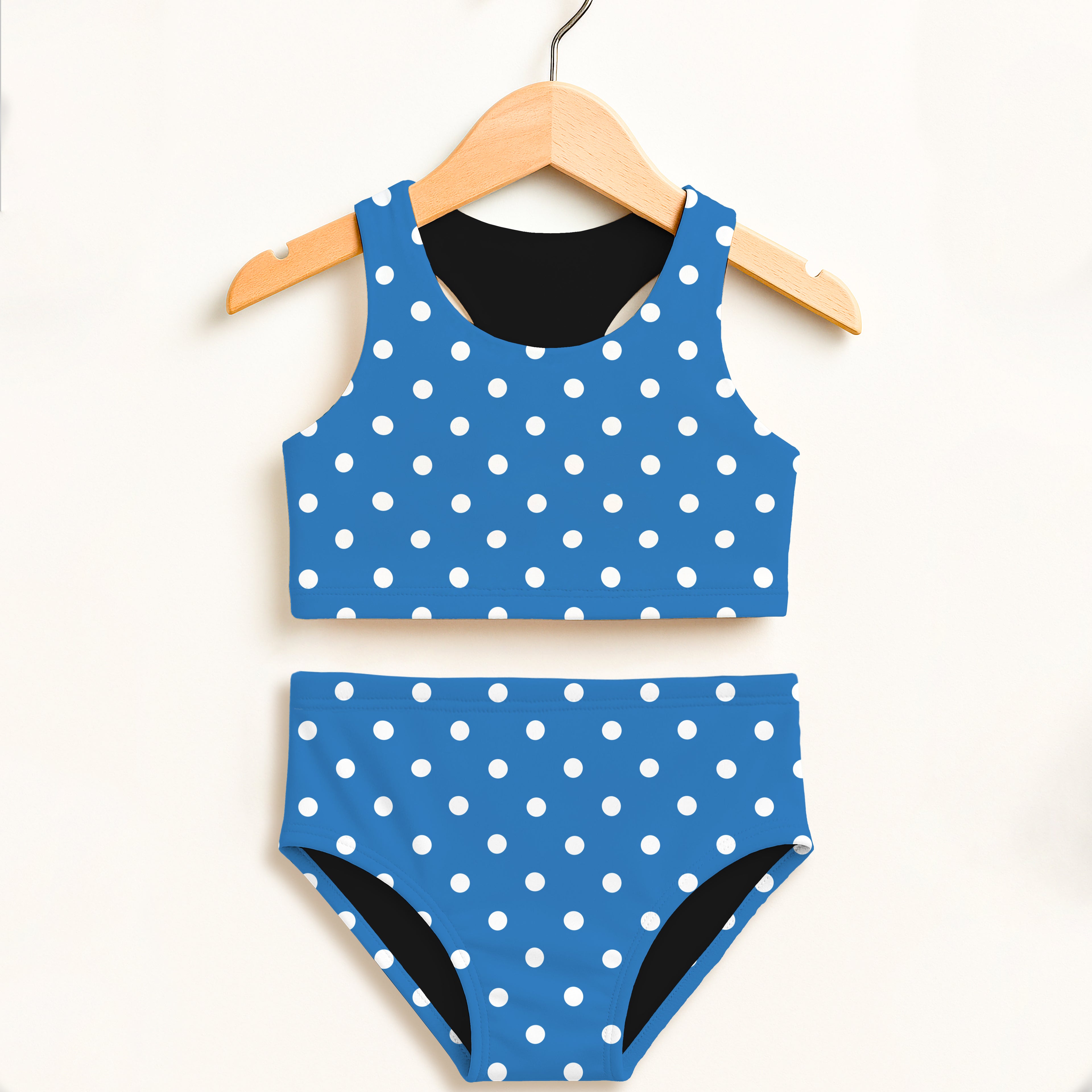 Girls blue polka dot two piece swimsuit with white dots black lining double layered upf 50 plus high waisted comfort