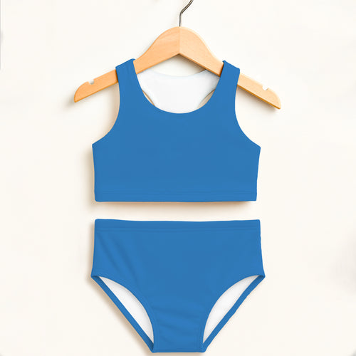 Girls blue two piece swimsuit with white lining hanging on wooden hanger featuring double layered upf 50+ fabric