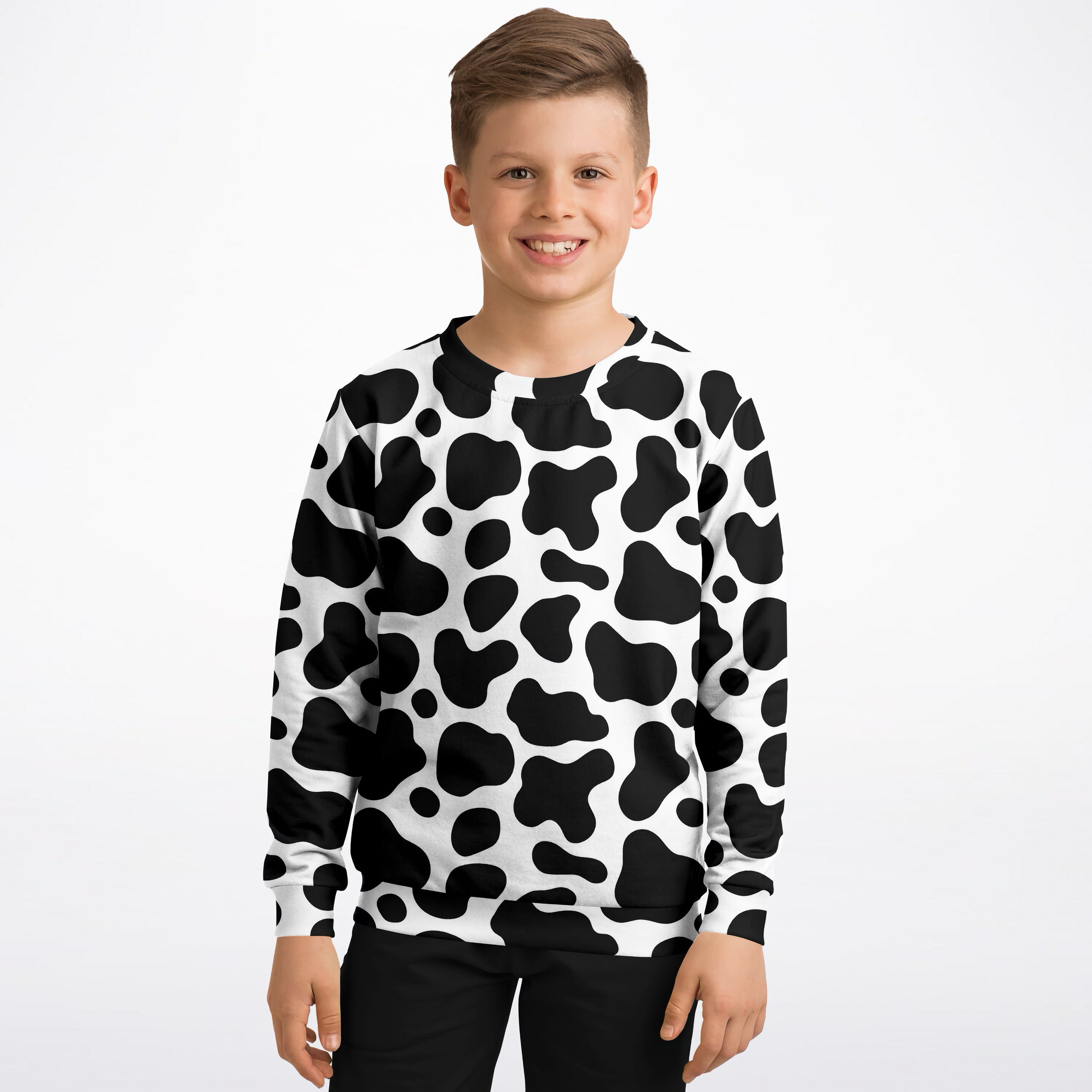 Kids cow print sweatshirt in black and white long sleeve made of cozy cotton fleece or lightweight sports fabric
