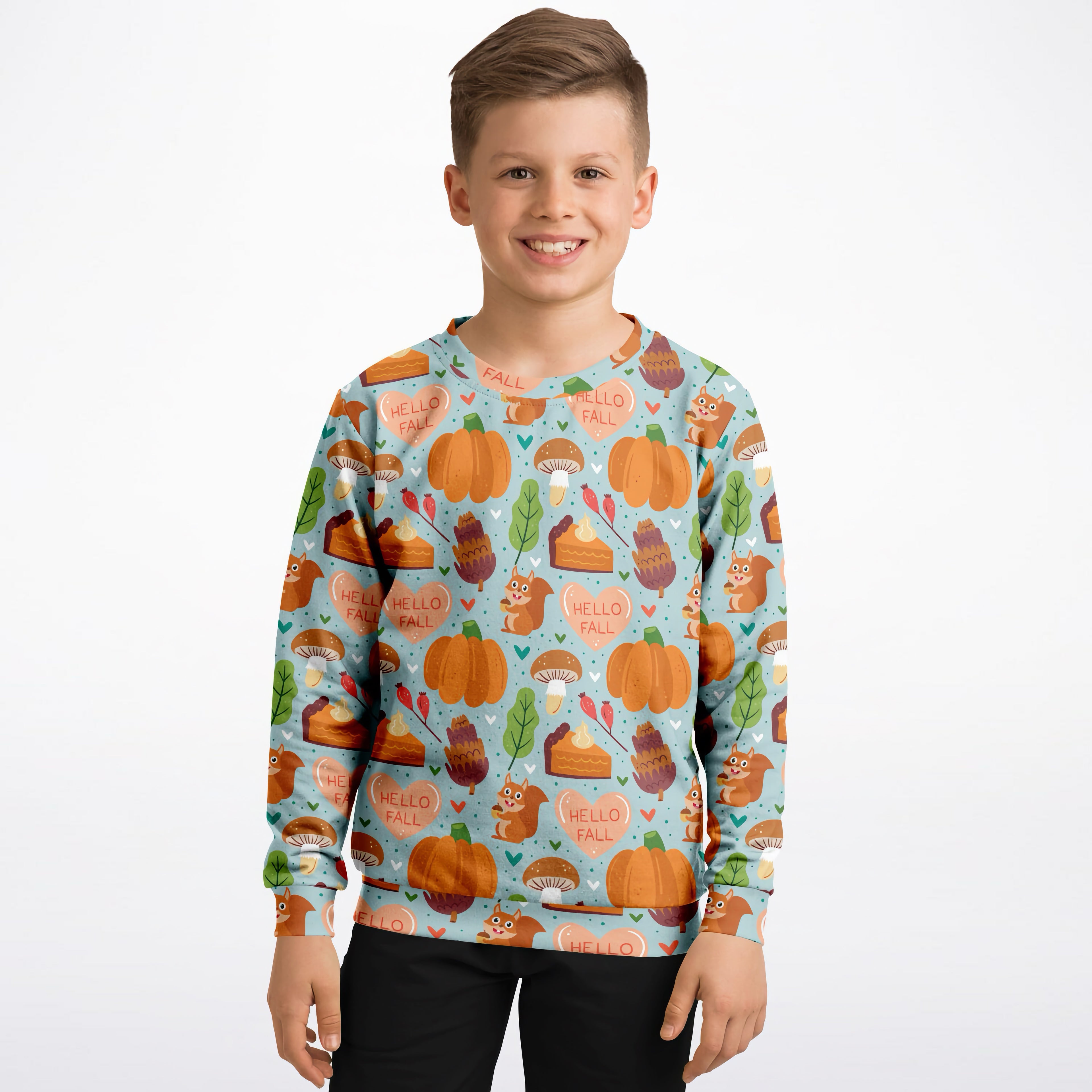A boy wearing a light blue kids hello fall autumn sweatshirt with pumpkins squirrels in cozy cotton fleece