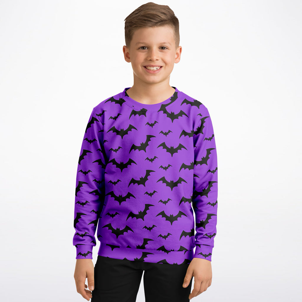 Kids purple long-sleeved sweatshirt with black bat patterns made of cozy cotton fleece for Halloween