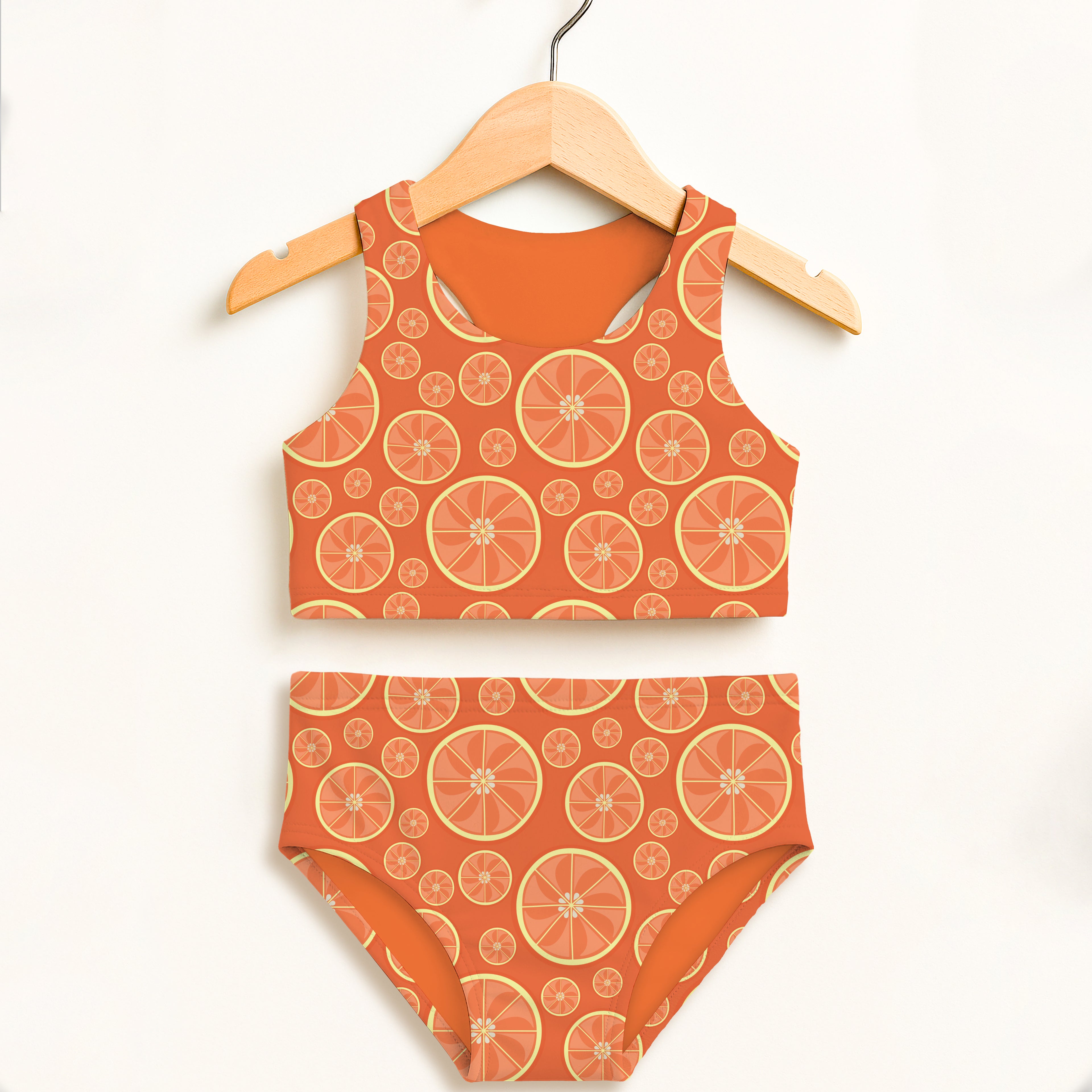Girls orange citrus two piece swimsuit with double layered fabric high waisted comfort and UPF 50 plus protection