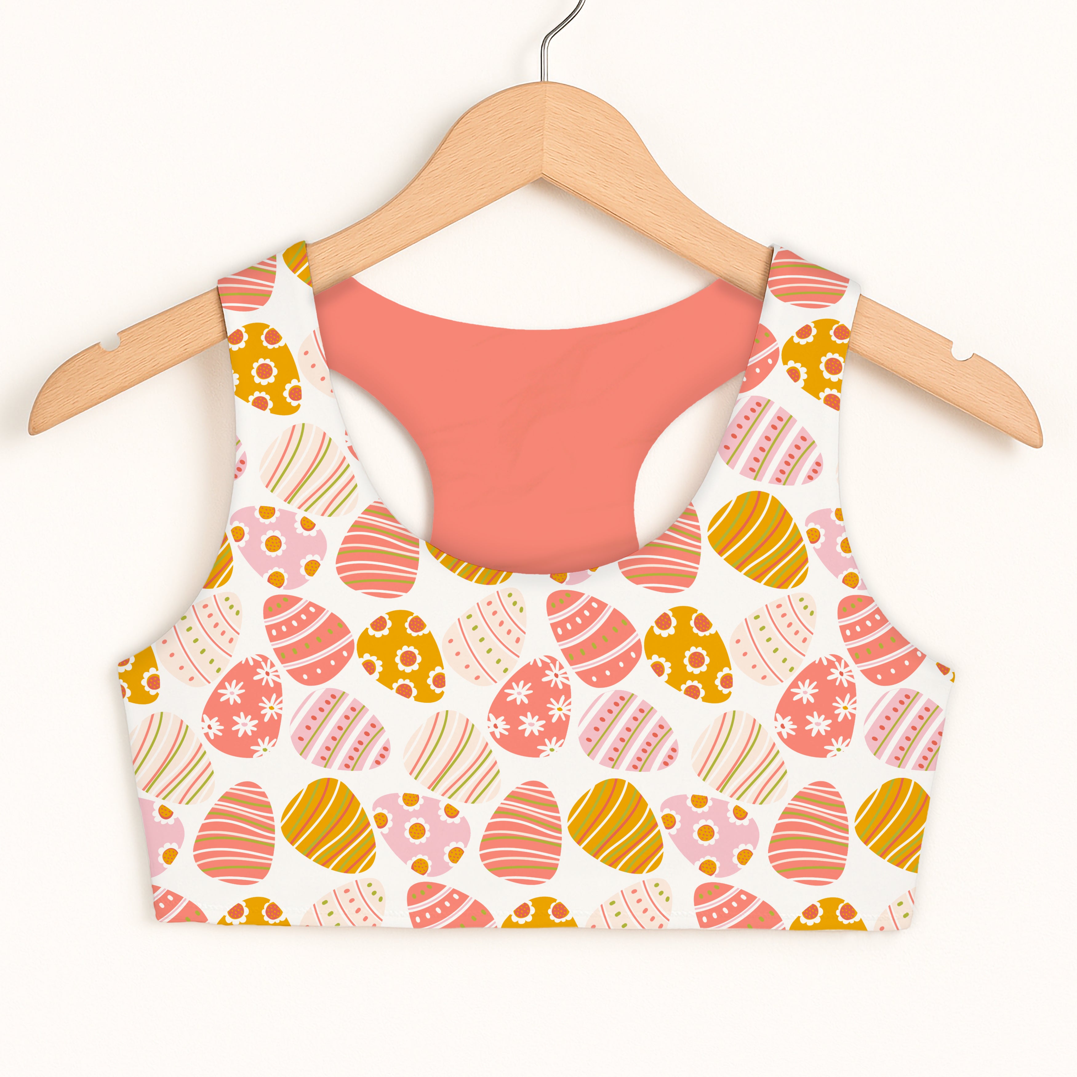 Girls coral and pink Easter egg sports bra with quick drying fabric double layered comfort and pastel pattern