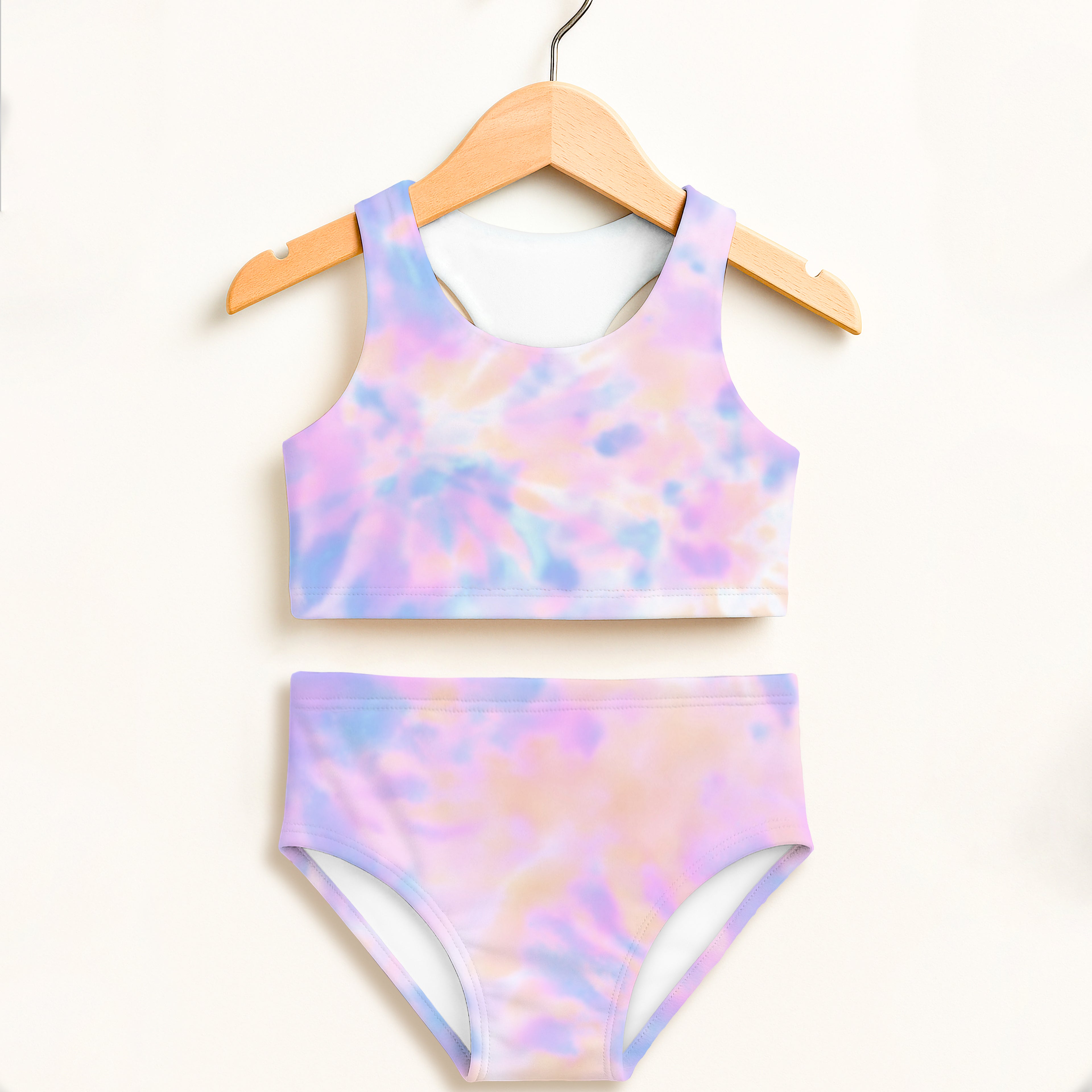 Girls pastel watercolor two piece swimsuit with halter top and high waisted bottoms in lavender pink and blue tie dye