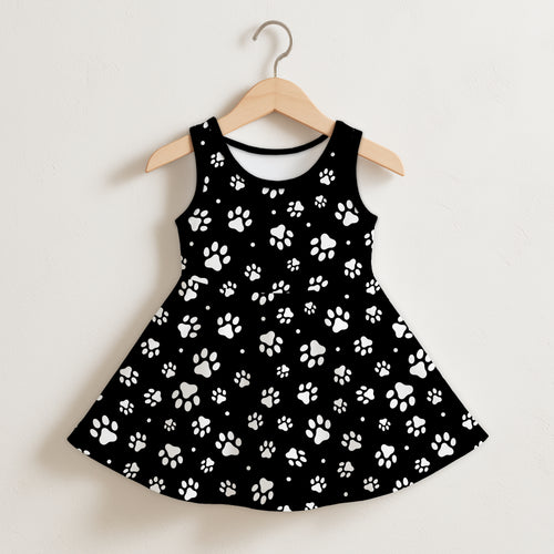 Girls black sleeveless toddler dress with playful white paw print pattern perfect for casual wear