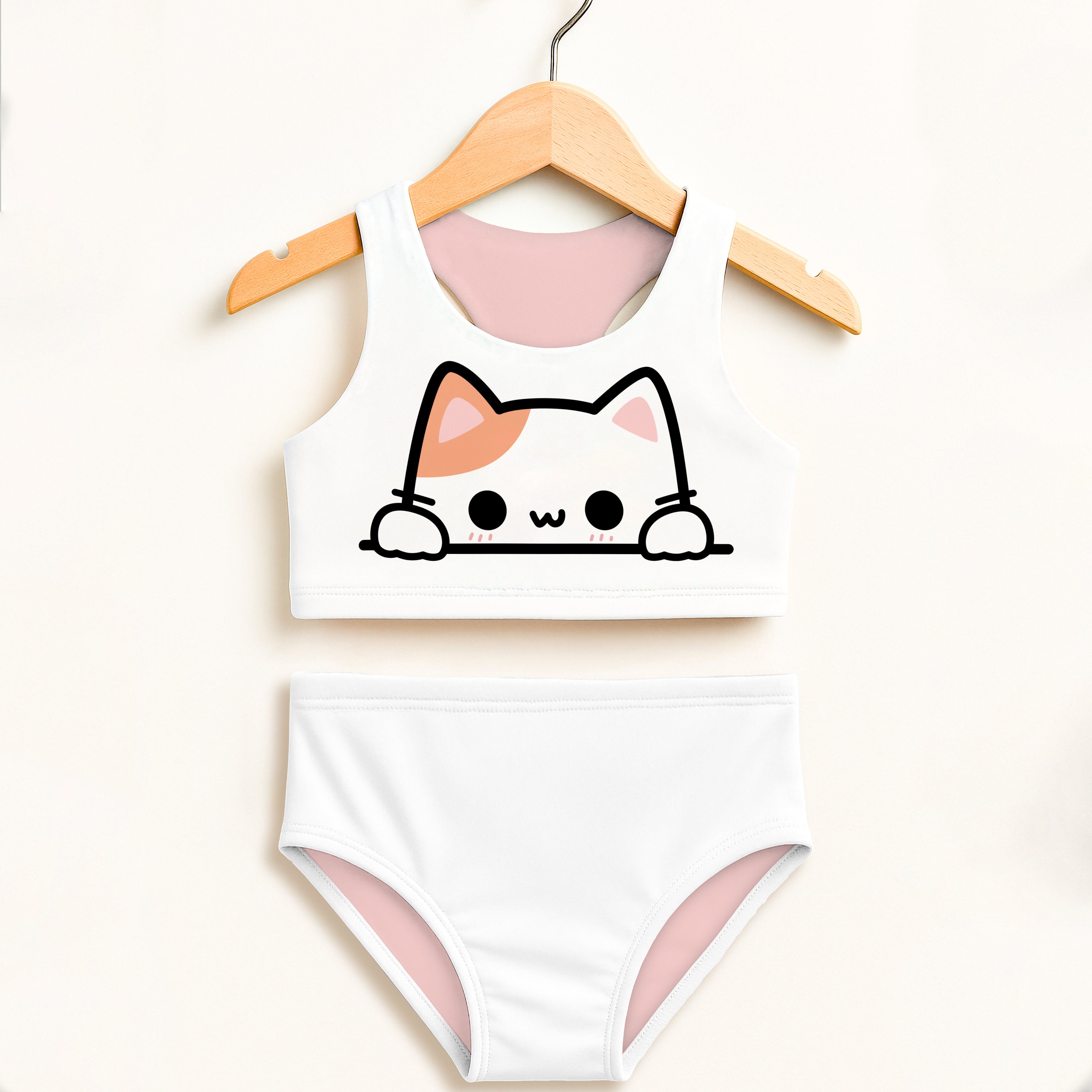 White cat-themed two-piece swimsuit for girls with pink lining black outline and double layered upf 50+ high waisted design