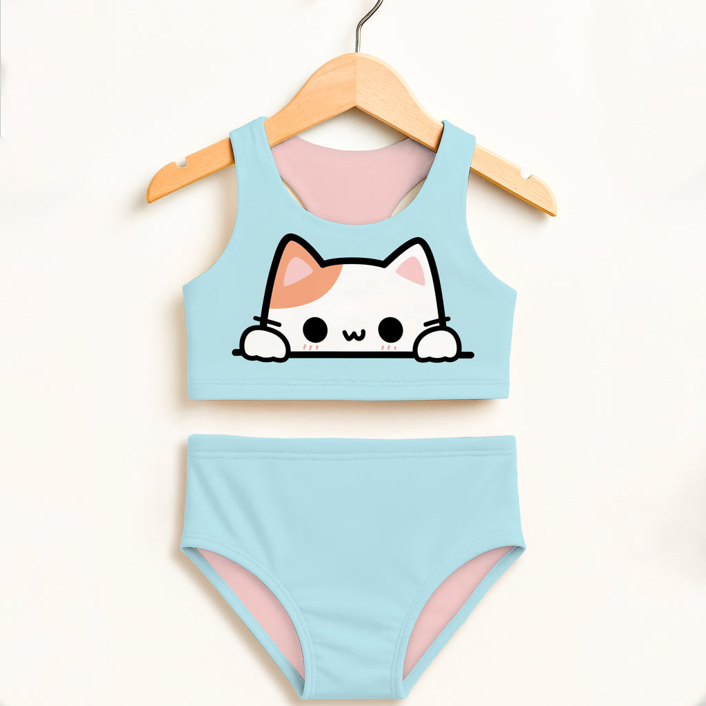 Light blue girls two-piece swimsuit with cartoon cat design peeking over top pink lining double layered upf 50+ high waisted